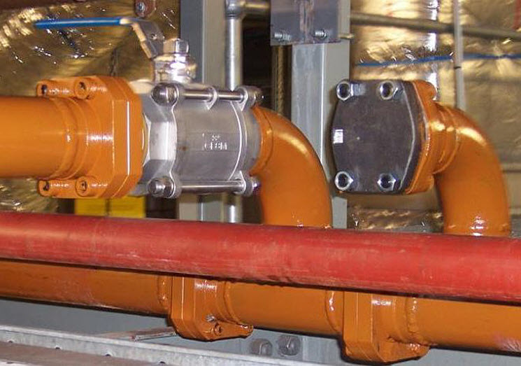 Orange pipes installed in a room